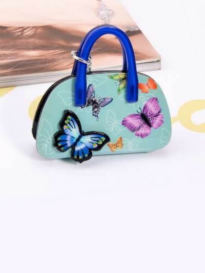 Молодіжний брелок сумочка з метеликами блакитний. Зображення товару, вид 3