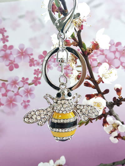 Брендовий брелок бджола із стразами срібло. Зображення товару, вид 1